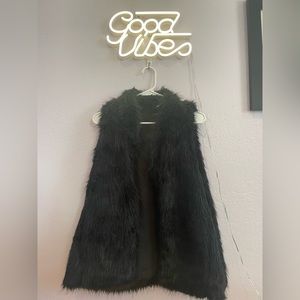 Charming Charlie’s black fur vest
